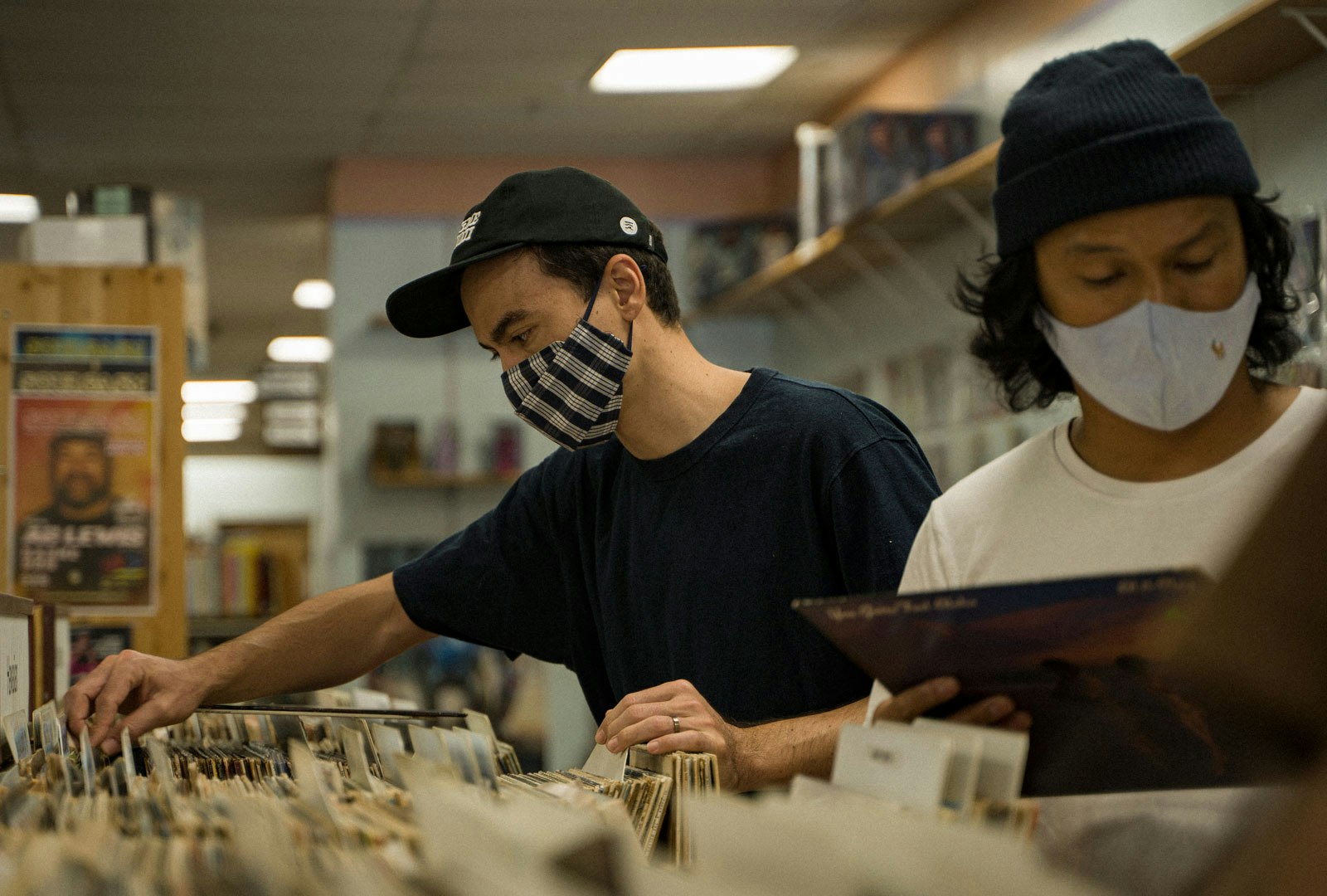 Roger Bong and friend Oliver digging at Idea’s Music and Books in Honolulu, Hawaii. Photo by Shota Akiyoshi.